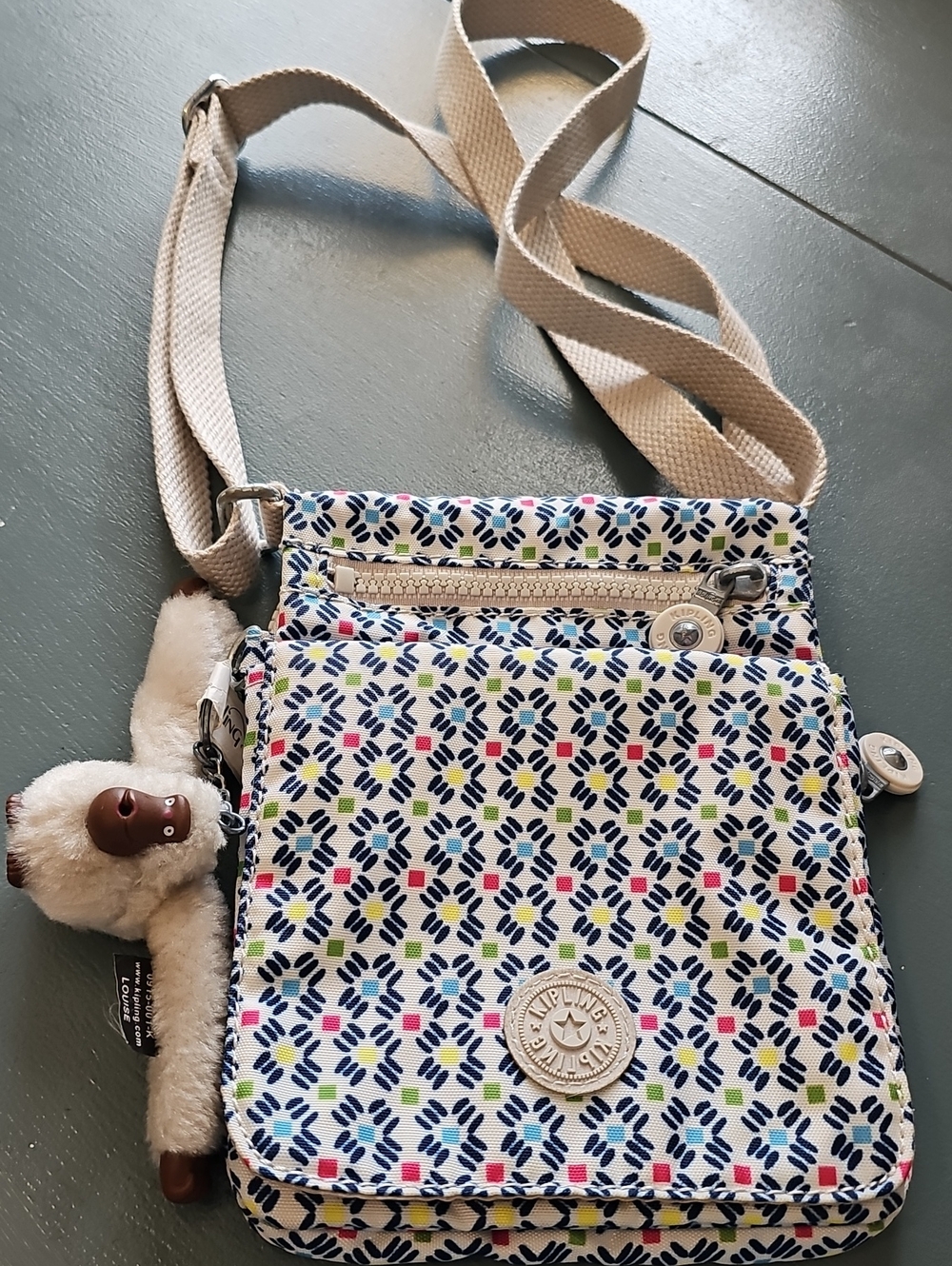 Kipling Small Crossbody Bag in White Multi-Color Pattern With Monkey.